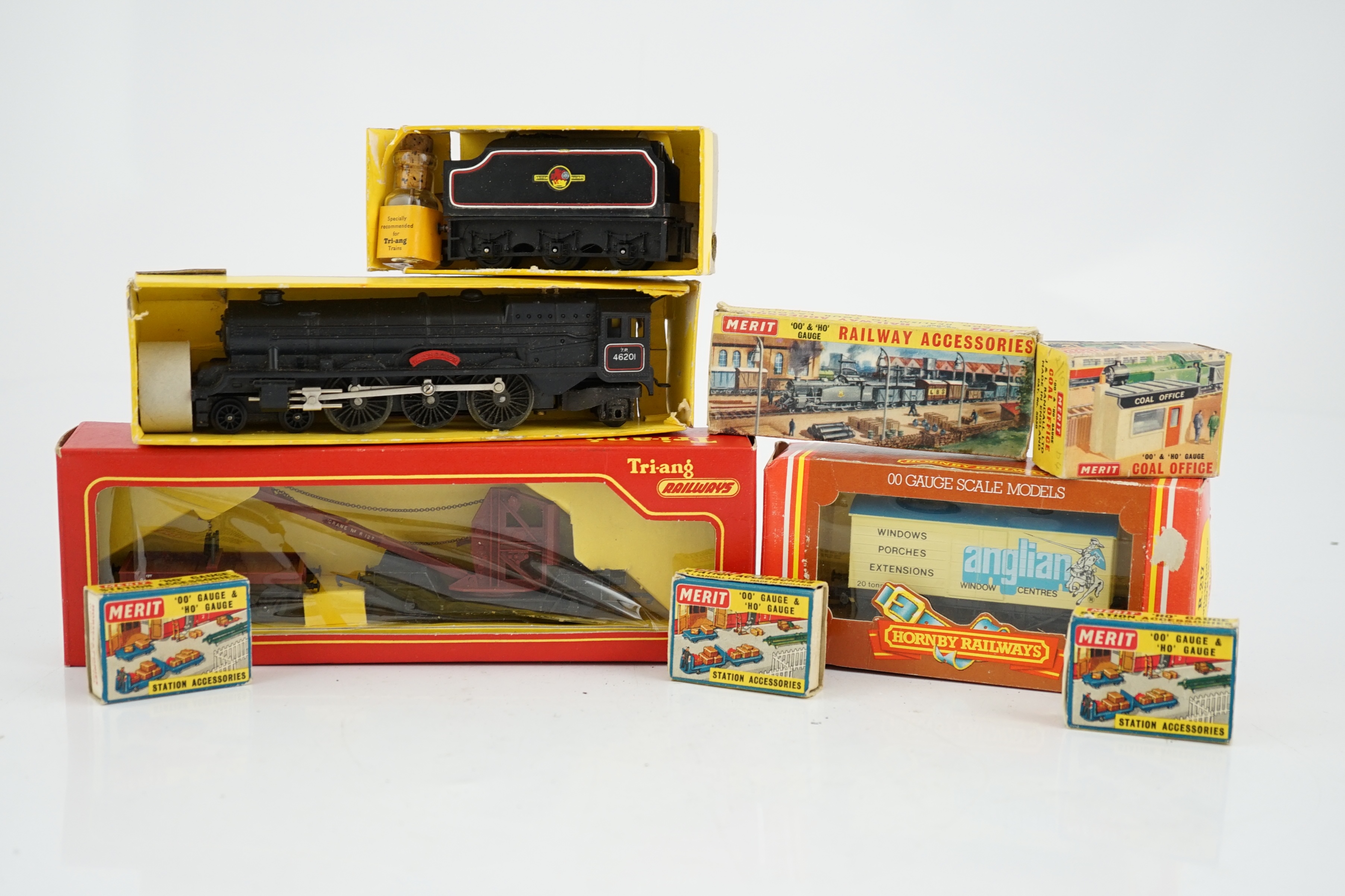 A collection of mostly Tri-ang Railways 00 gauge model railway, including three locomotives; a BR saddle tank loco (R153), a BR Princess Royal class 4-6-0 and an S.R. Suburban Motor Coach driving unit